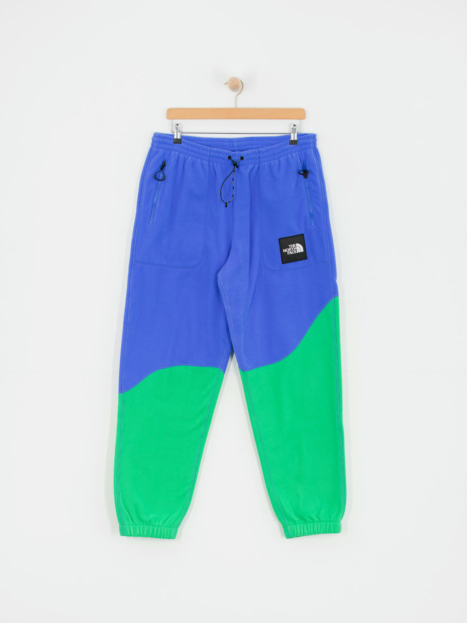 Pantaloni The North Face X Yinka Ilori Fleece (solar blue/optic emeral)