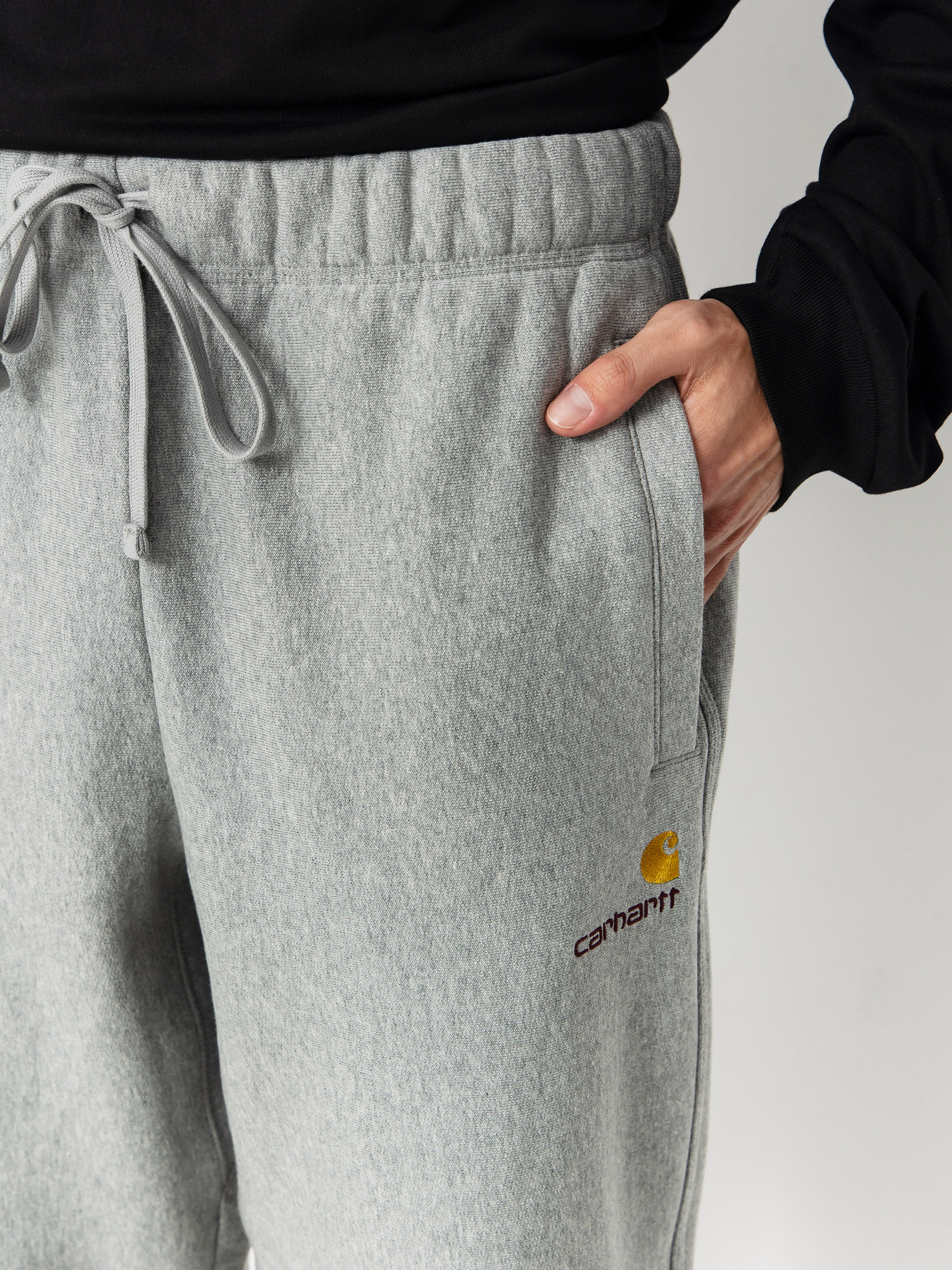 Pantaloni Carhartt WIP American Script Jogging (grey heather)