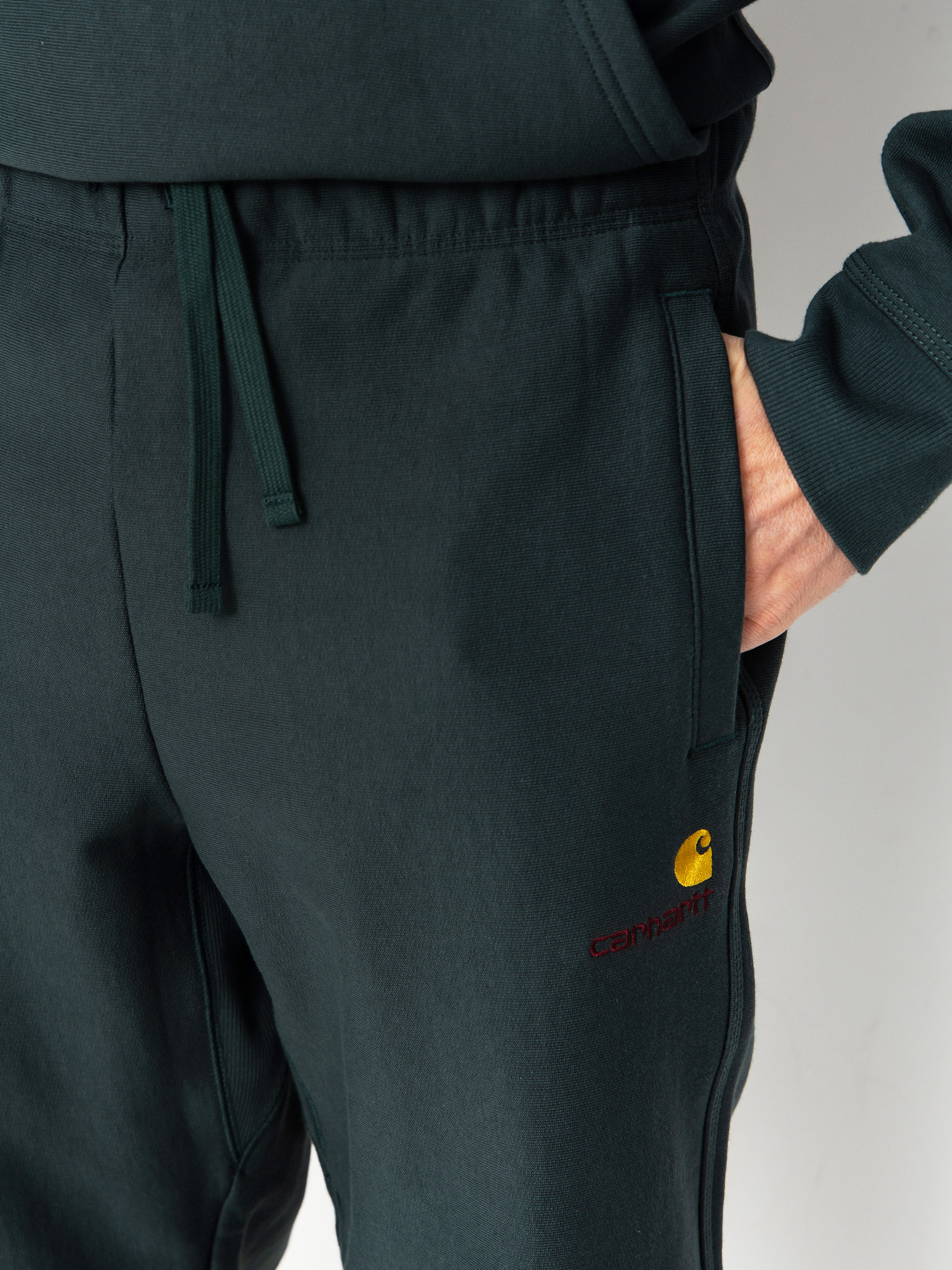 Pantaloni Carhartt WIP American Script Jogging (kale green)
