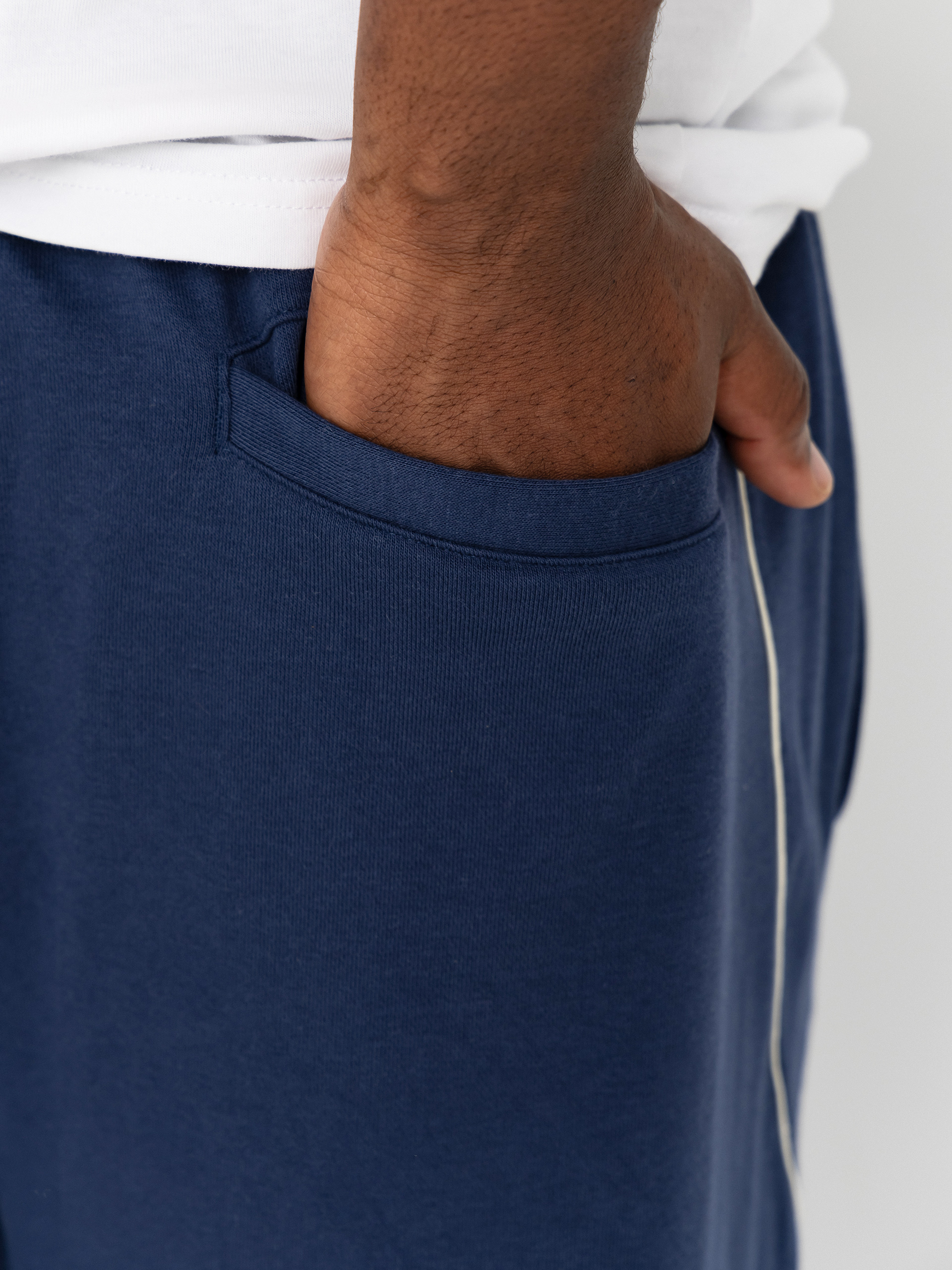 Pantaloni New Balance Trackside French Terry (navy)